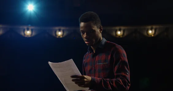 Man readig a script